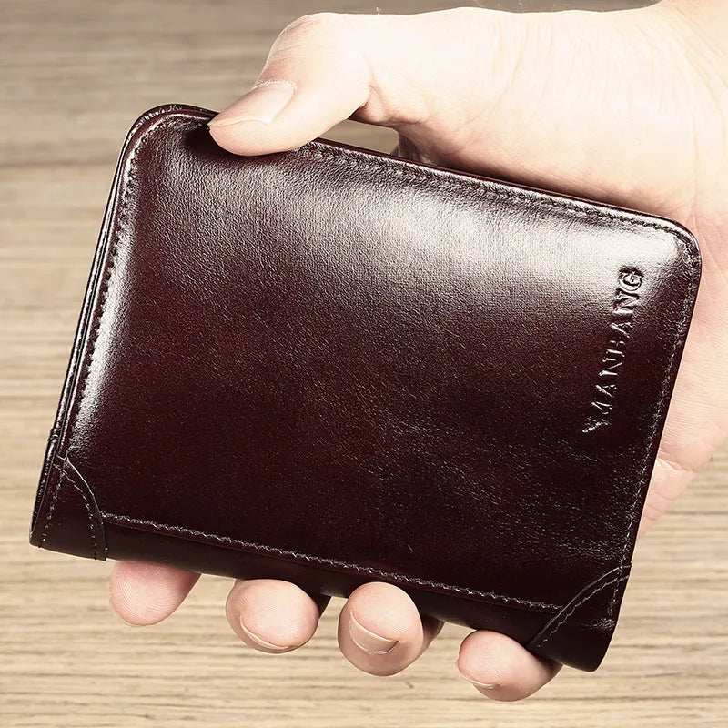 Men's brown leather bifold wallet open to show card slots, coin pocket, and banknote compartment.