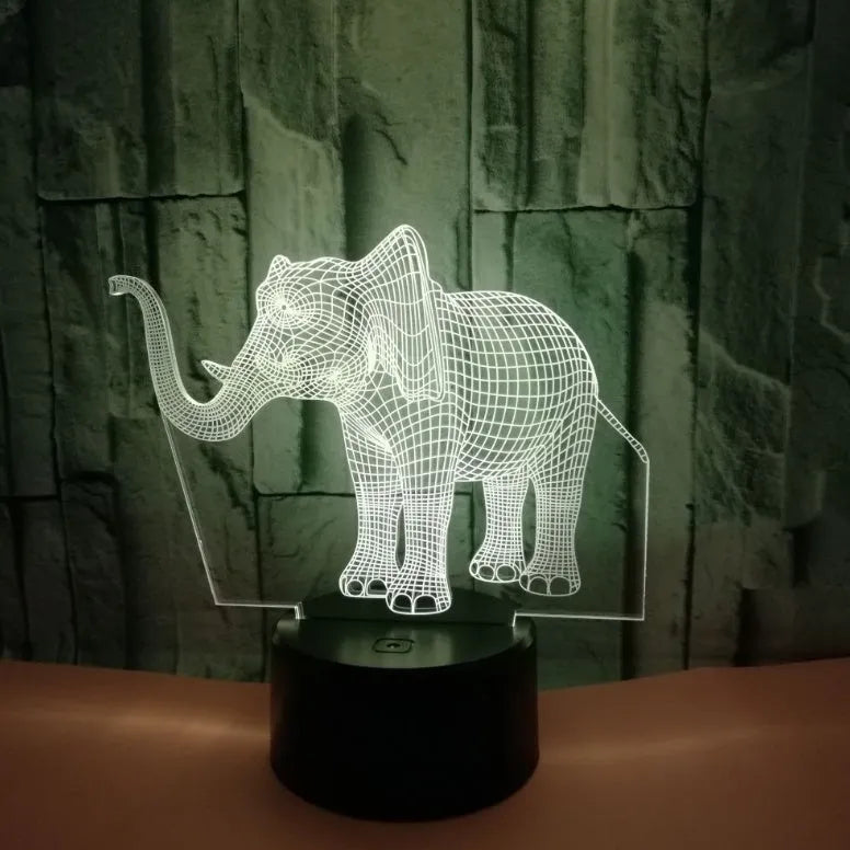 3D LED elephant touch lamp showing seven colour modes on a wooden desk