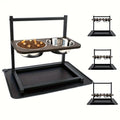 Black iron dog bowl feeding station set with two bowls on a rack, showing three height adjustment levels.