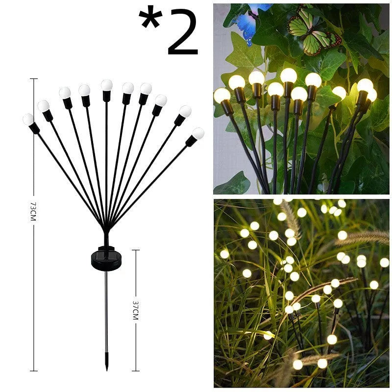 Solar-powered LED garden light with multiple heads on a stainless steel stake, placed in soil.