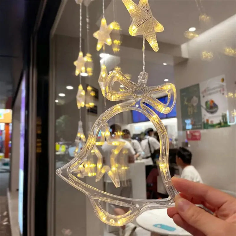 Set of three battery-powered LED Christmas pendant lights with suction cups, showing star, tree, and deer designs.
