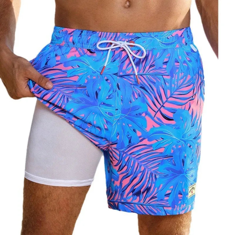 Men's loose green floral print boxer swimming trunks made from quick-drying spandex fabric.
