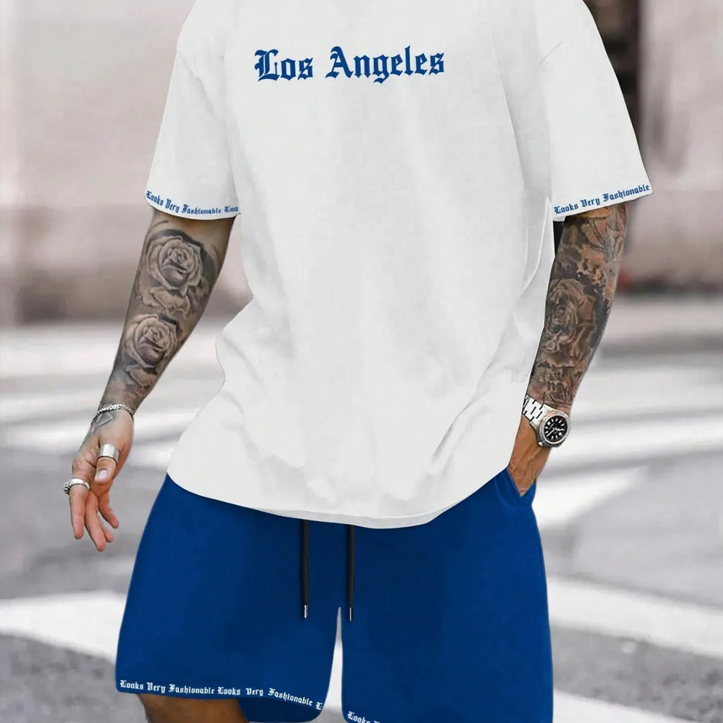 Men's blue printed short sleeve top and matching shorts sports set laid flat