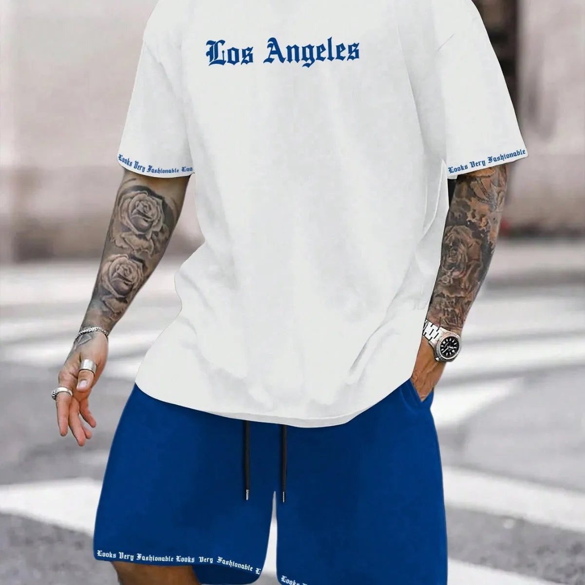Men's blue printed short sleeve top and matching shorts sports set laid flat