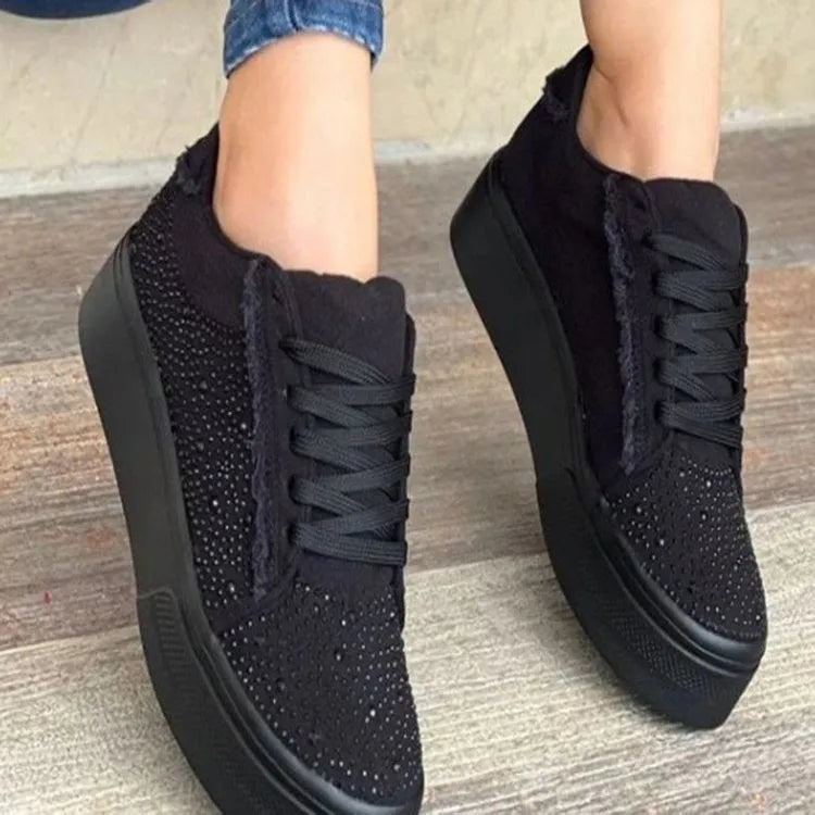 Plus size women's black lace-up casual sports shoes with rhinestone details and a thick flat rubber sole.