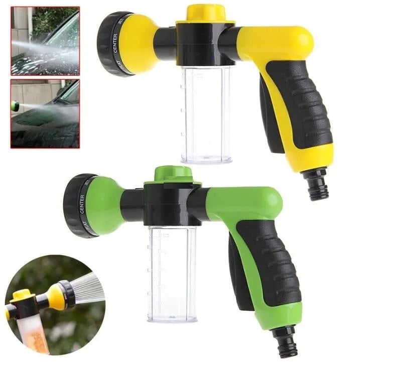 Green high-pressure foam spray gun with adjustable nozzle and connected water hose for car and garden cleaning.