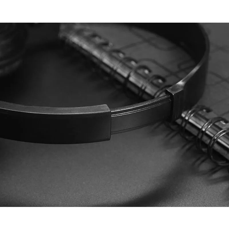Black folding wired over-ear headphones with adjustable headband and 3.5mm plug on a 1.2m cable.