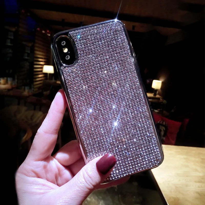 Silver glitter diamond pattern silicone phone case with crystals for iPhone.