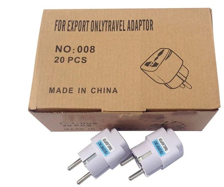 A multi country travel conversion plug for British, American, Australian, and European power sockets.