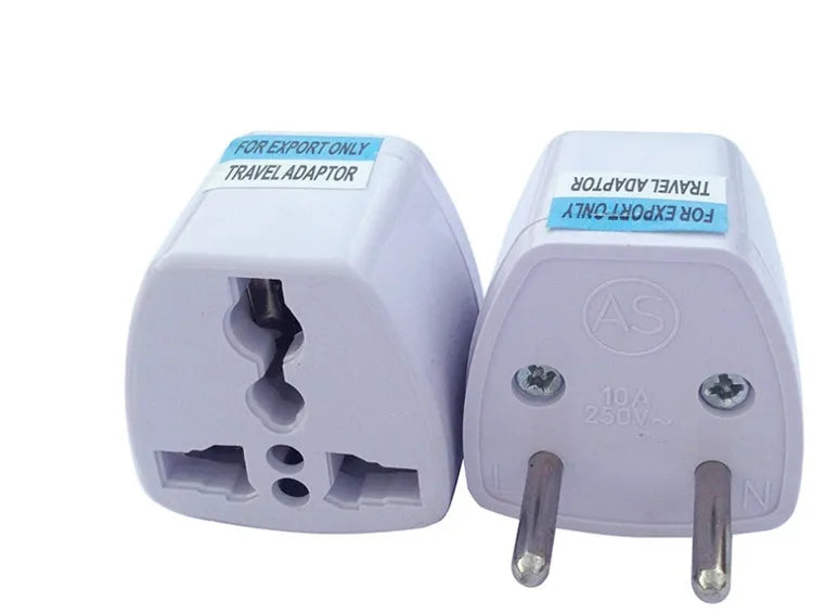 A multi country travel conversion plug for British, American, Australian, and European power sockets.