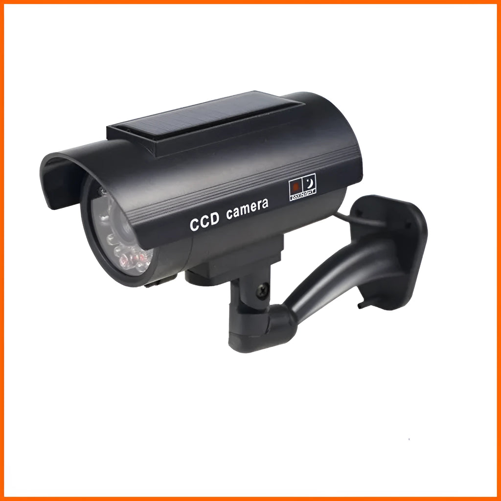 Black plastic gun-shaped dummy security camera with solar panel and red LED light indicator