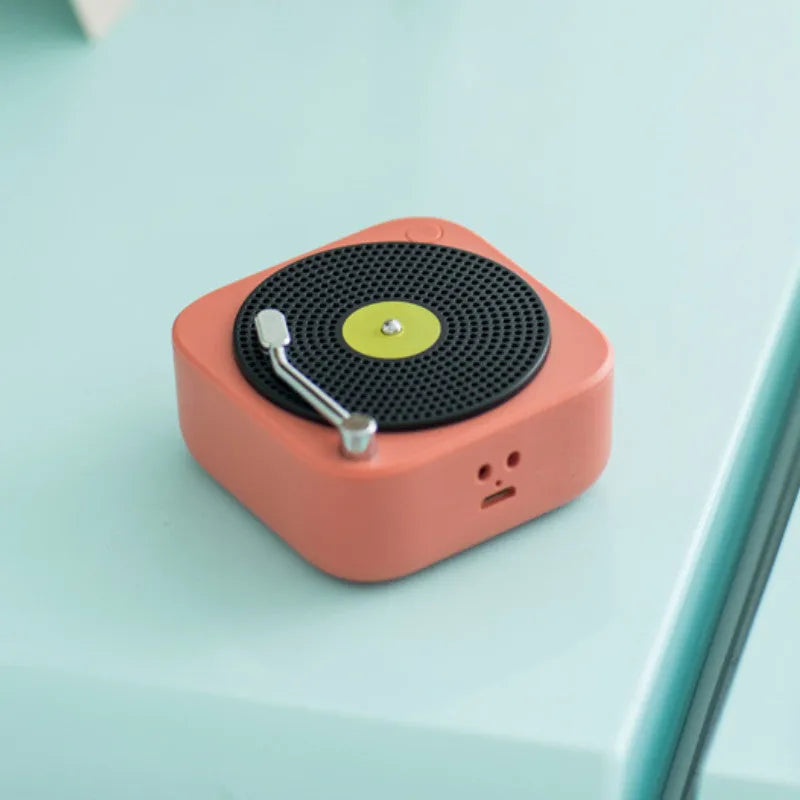 Wireless mini portable Bluetooth speaker in compact design with USB charging, available in blue, green, orange, white colours