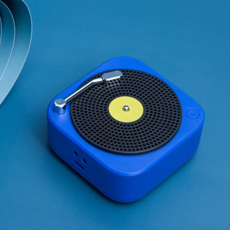 Wireless mini portable Bluetooth speaker in compact design with USB charging, available in blue, green, orange, white colours