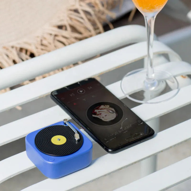 Wireless mini portable Bluetooth speaker in compact design with USB charging, available in blue, green, orange, white colours