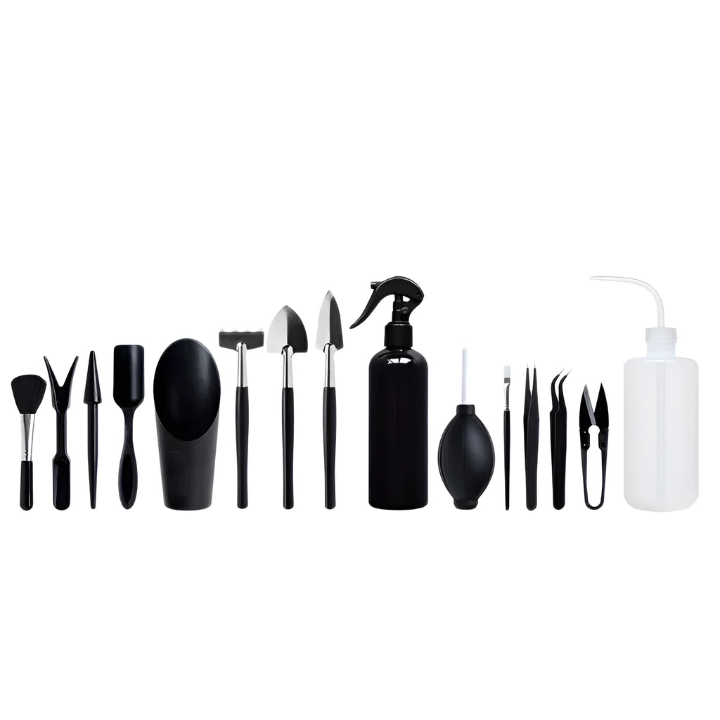 Black succulent garden tools set with shovel, tweezers, scissors, watering bottle and a square grey cushion.