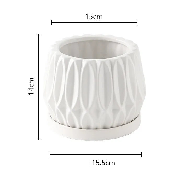 A simple grey ceramic flowerpot, medium-sized, for tabletop or floor plants.