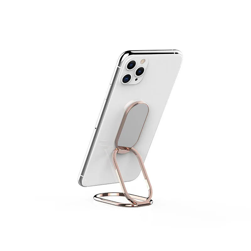 Ring buckle metal magnetic folding lazy phone holder on a desktop in black.
