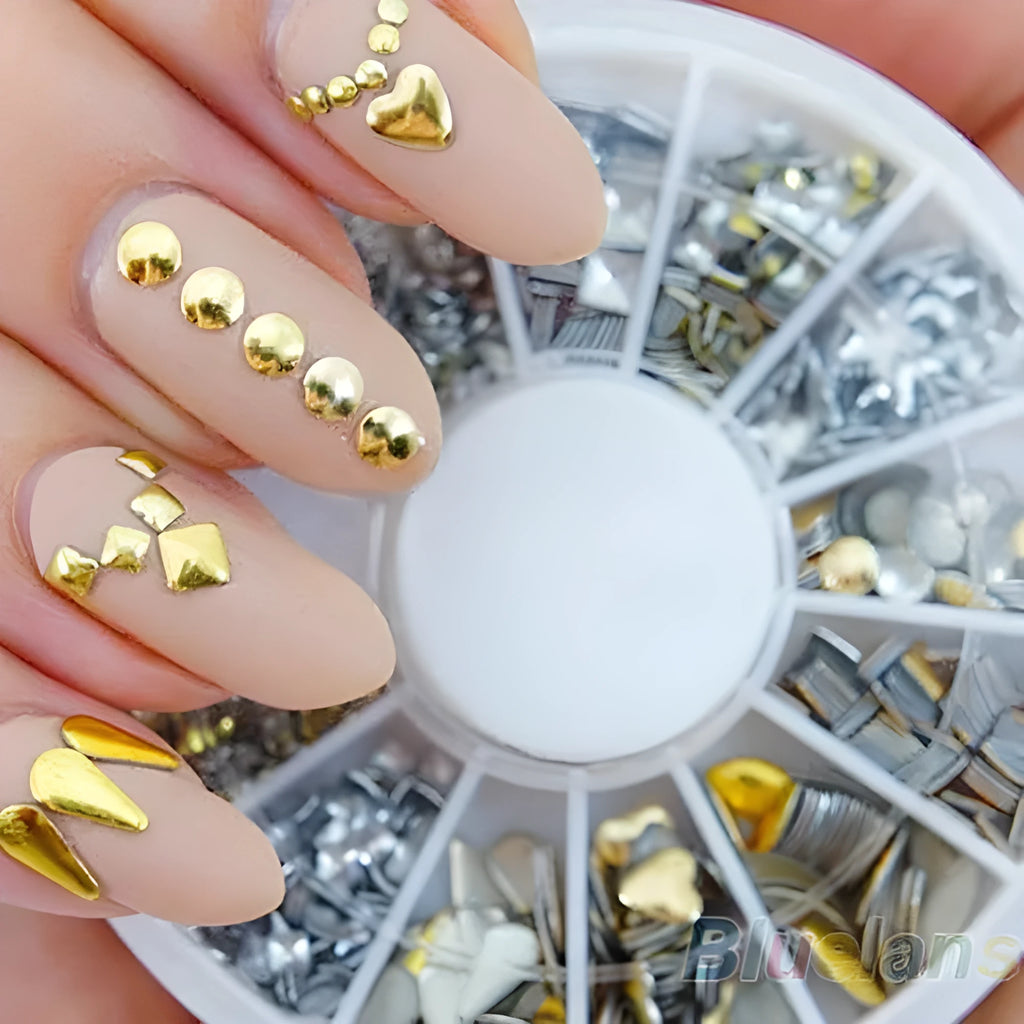 Gold and silver acrylic nail art stickers on a white backing sheet, ready for DIY nail decoration