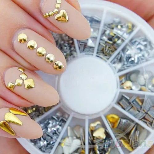 Gold and silver acrylic nail art stickers on a white backing sheet, ready for DIY nail decoration