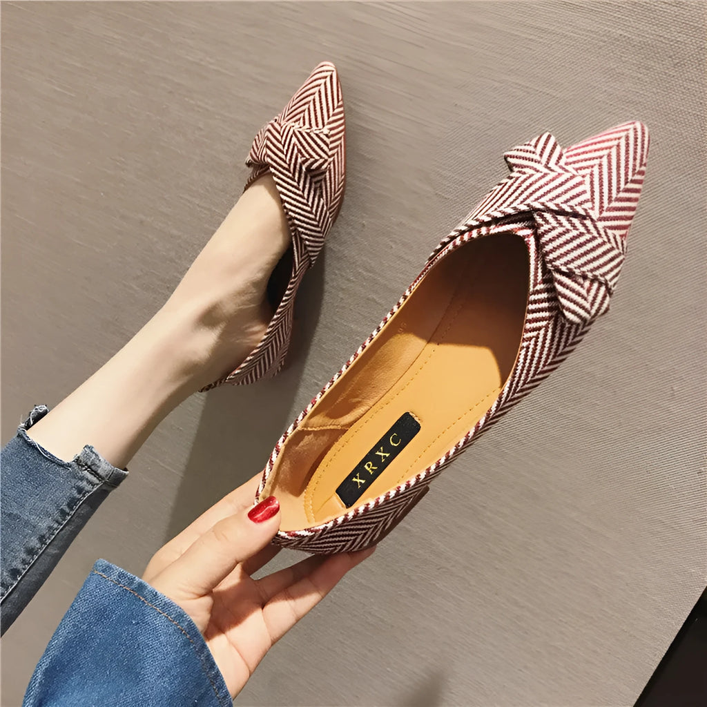 Women's pointed toe flat shoes in red with a low heel and cotton upper.