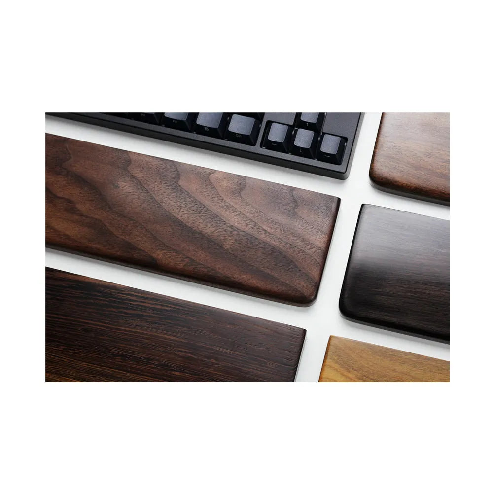 Solid black walnut wood keyboard wrist rest measuring 30cm long with curved ergonomic design