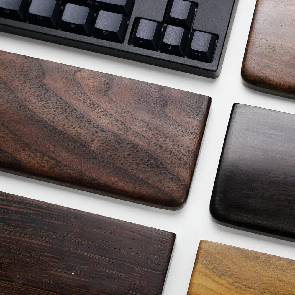 Solid black walnut wood keyboard wrist rest measuring 30cm long with curved ergonomic design