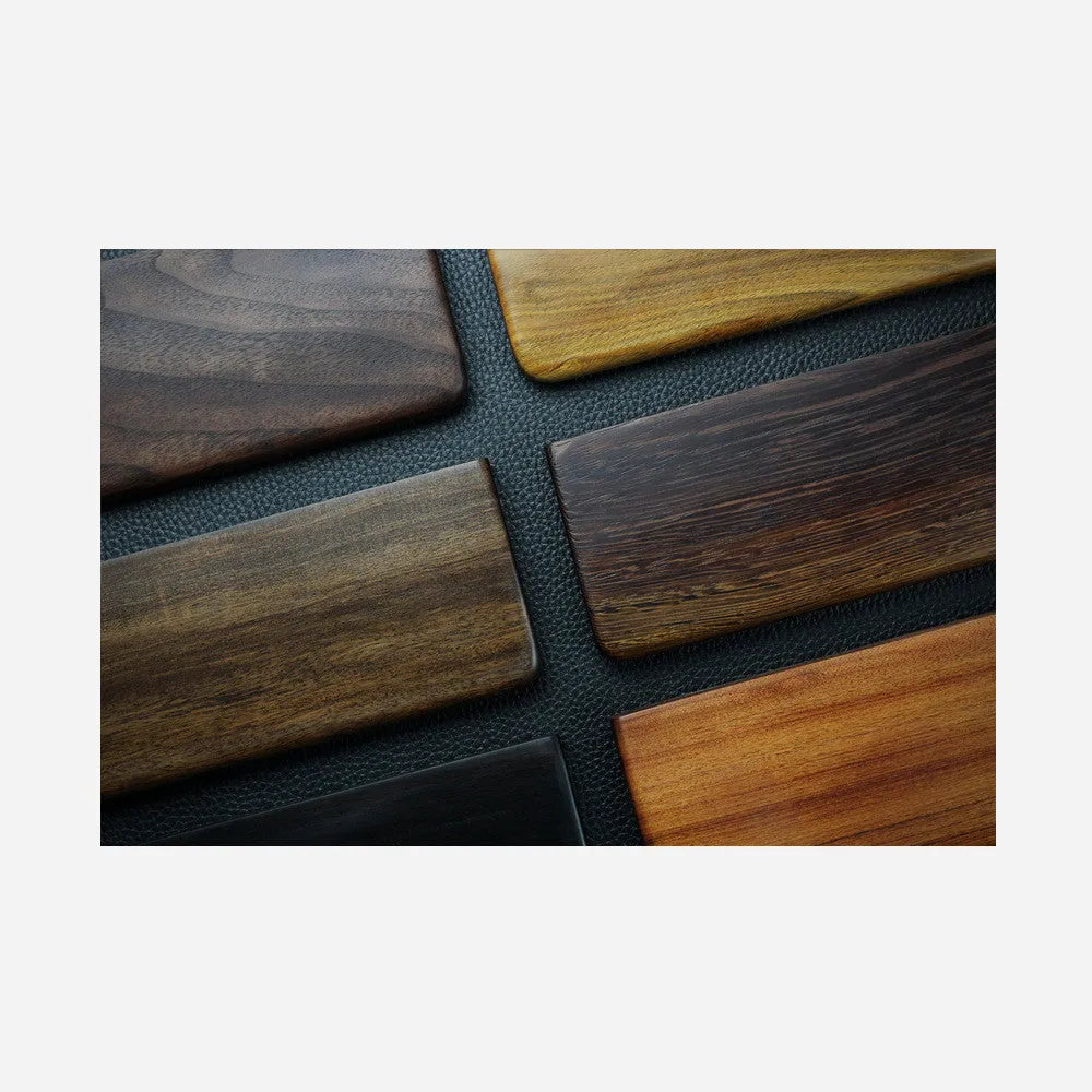 Solid black walnut wood keyboard wrist rest measuring 30cm long with curved ergonomic design