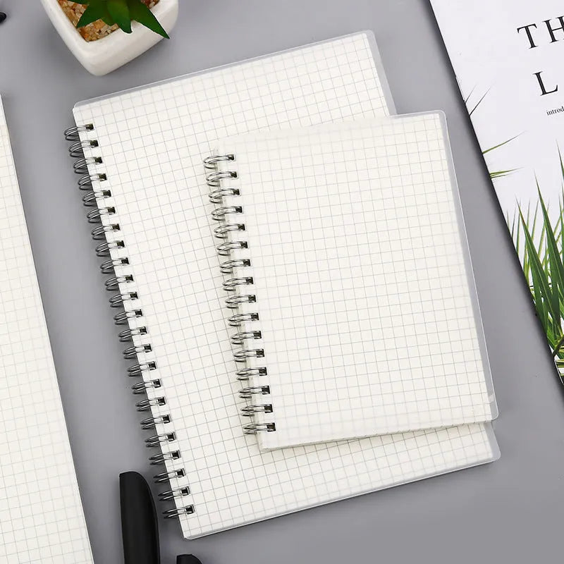 Coil-bound notebook with horizontal line and dot matrix grid pages in A5 size.