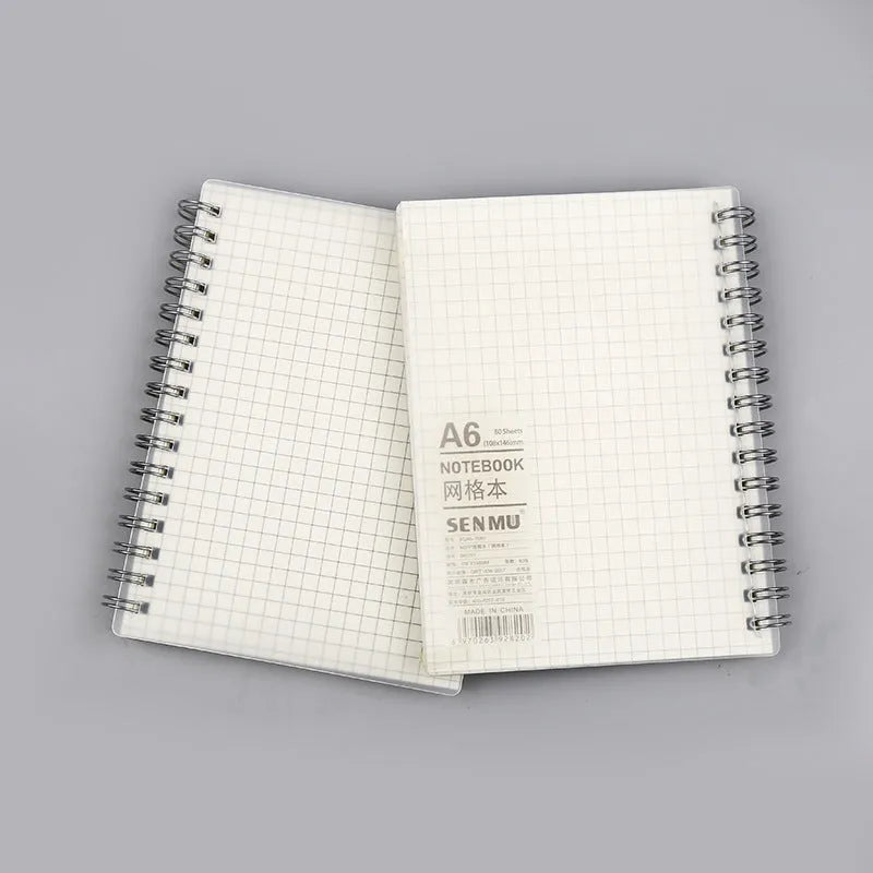 Coil-bound notebook with horizontal line and dot matrix grid pages in A5 size.
