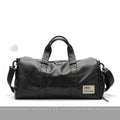 Black PU leather sports training bag showing internal organiser pockets for laptop and phone.