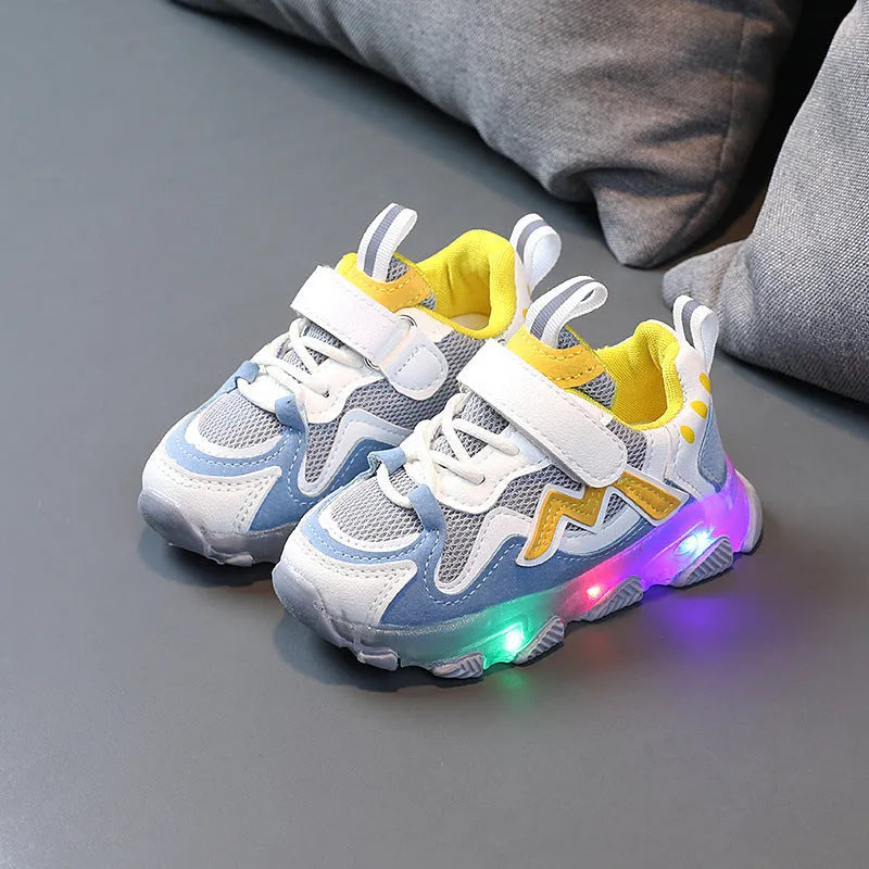 Children's black mesh Velcro sneakers with rubber sole, shown on a child's foot