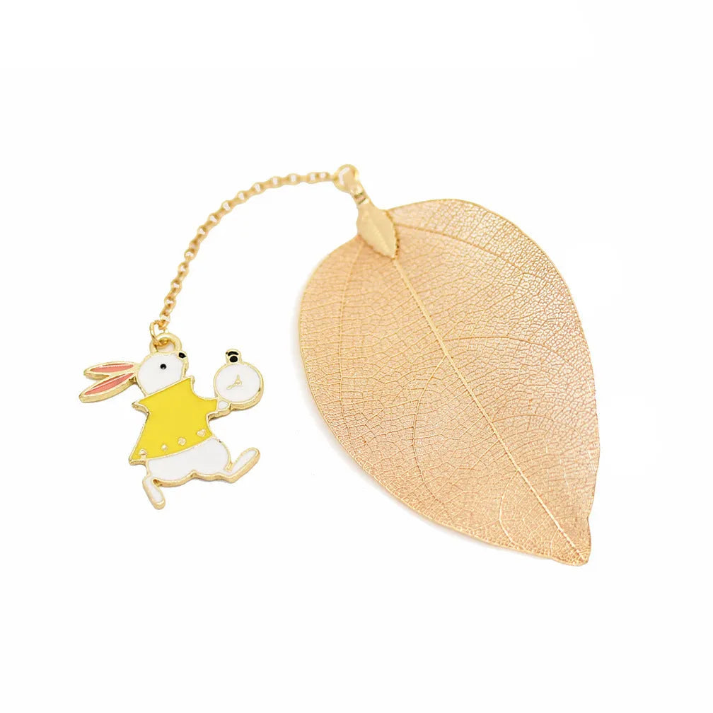 Kc alloy leaf bookmark with a choice of Alice, rabbit, or clock charm, shown with dimensions.