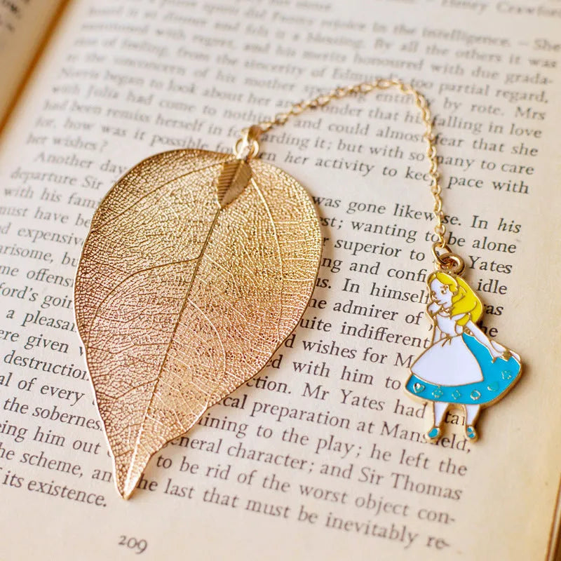 Kc alloy leaf bookmark with a choice of Alice, rabbit, or clock charm, shown with dimensions.