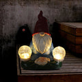 Solar LED resin dwarf garden statue with faceless old man design, 27cm tall outdoor ornament