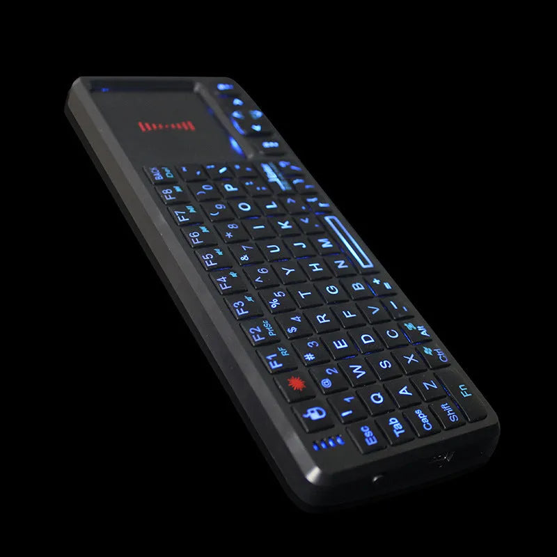 Black laser teaching mini wireless keyboard with a touch screen on a desk