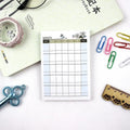Pocket-sized weekly monthly planner notebook showing four different layout design options