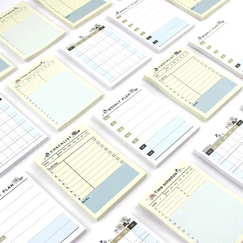 Pocket-sized weekly monthly planner notebook showing four different layout design options