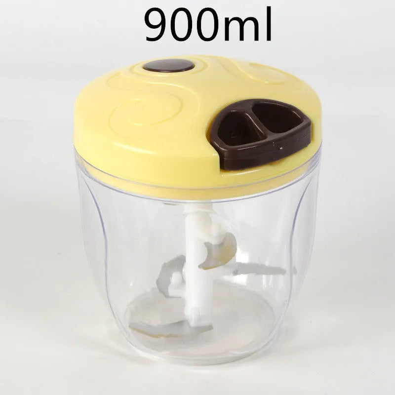 Green manual kitchen chopper with lid, showing stainless steel blades inside, on a countertop.