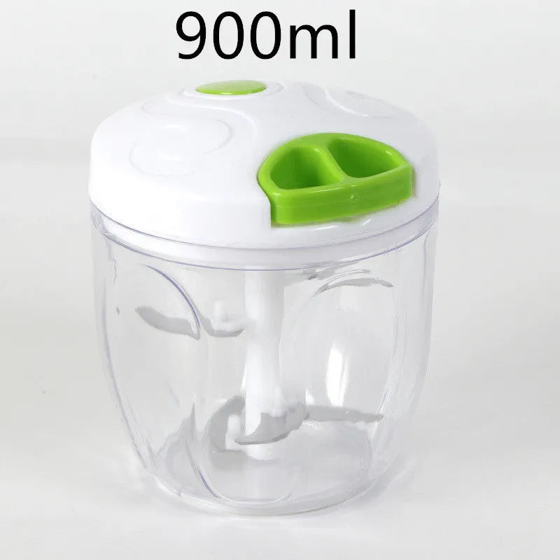 Green manual kitchen chopper with lid, showing stainless steel blades inside, on a countertop.