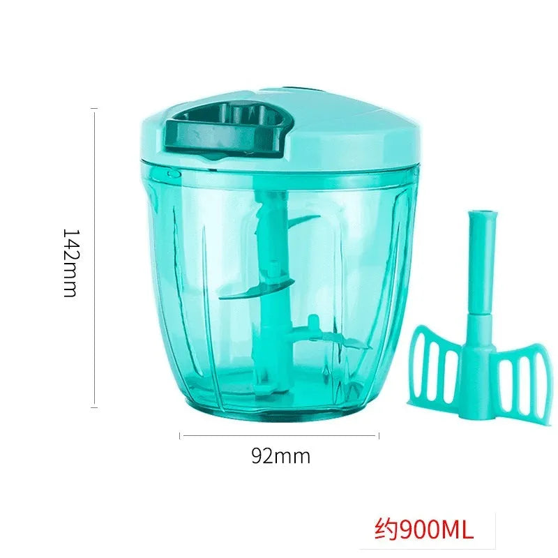 Green manual kitchen chopper with lid, showing stainless steel blades inside, on a countertop.