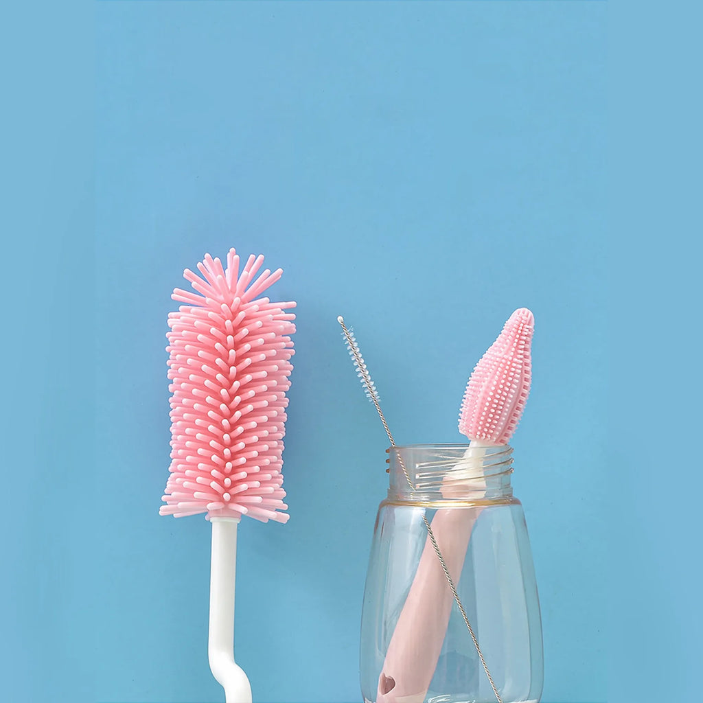 Silicone baby bottle brush cleaning set with bottle brush, straw brush, teat brush, and case in pink colour.