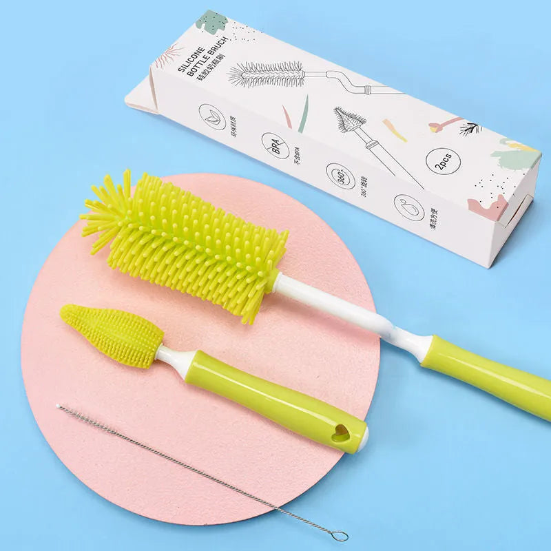 Silicone baby bottle brush cleaning set with bottle brush, straw brush, teat brush, and case in pink colour.
