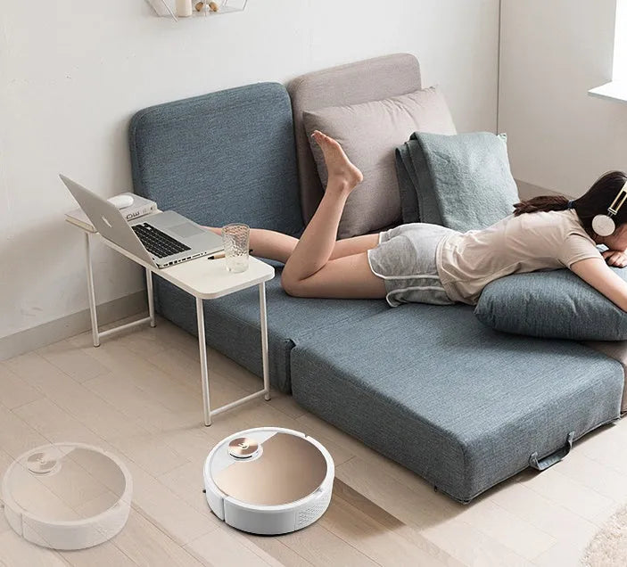 Silver or golden robot vacuum cleaner with remote control measuring 300x300x70mm