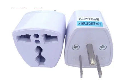 A multi country travel conversion plug for British, American, Australian, and European power sockets.