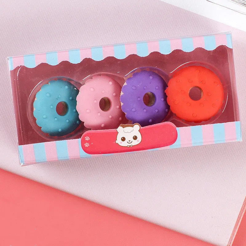 Set of 12 colourful cartoon erasers shaped like ice cream, doughnuts, and lollipops.
