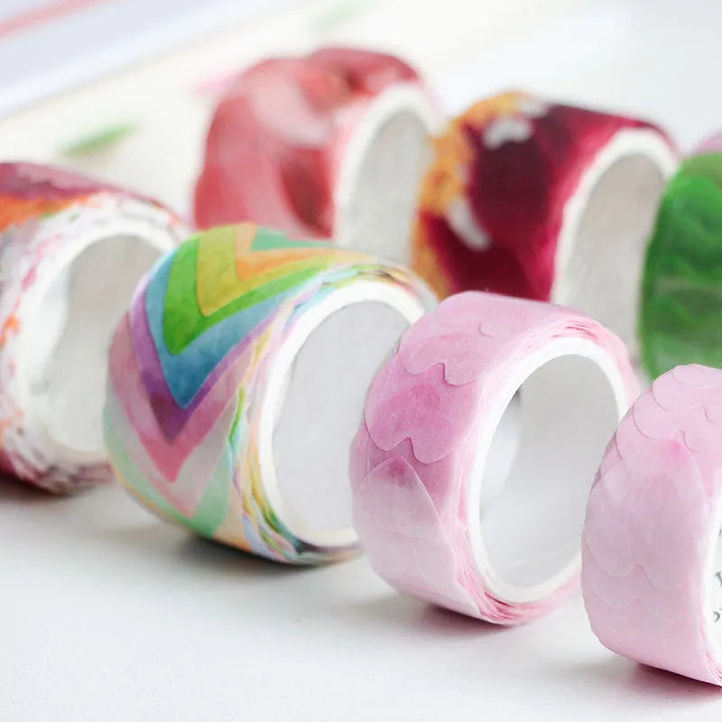 Roll of clover and paper tape in blue, cherry blossom, mixed colour, and violet options for hand book stickers.