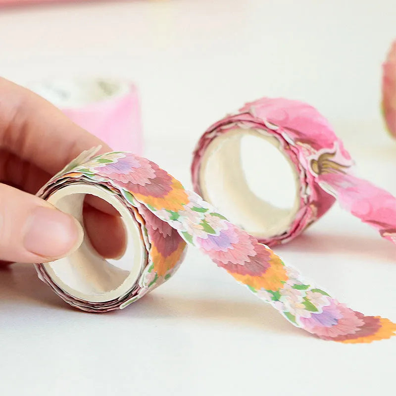 Roll of clover and paper tape in blue, cherry blossom, mixed colour, and violet options for hand book stickers.