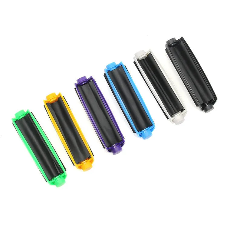Plastic manual cigarette maker cone in assorted colours on a white background.