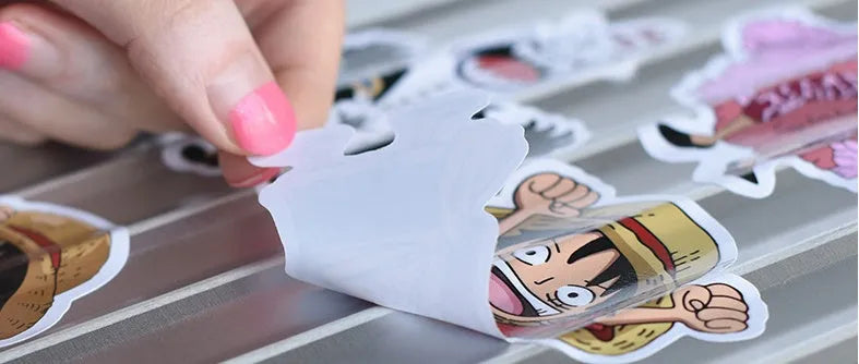 Assortment of 100 mixed graffiti and cartoon car stickers on a 10cm by 12cm card.