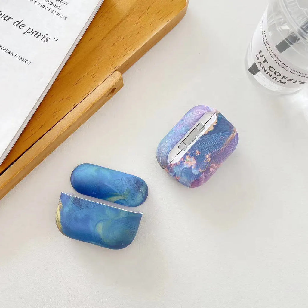 AirPods Pro hard shell protective sleeve with watercolour design in pink and blue colour options